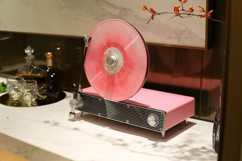 Sleek vertical turntable brings bold colors & vintage mood to any room